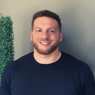Chiropractor Chris Ntor-Ue is seen smiling at the viewer
